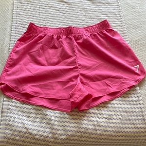 Bright pink gymshark shorts